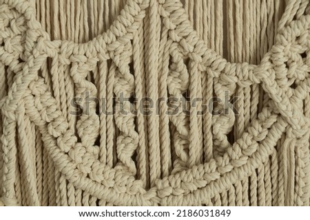 Detail od the handmade macrame - wall decoration, hand work from ropes - natural boho style, decoration to studio, nodes