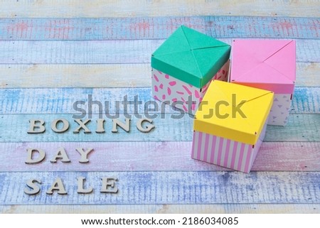 Three gift boxes on shabby background. Boxing day sale and copy space for text