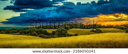 Panorama of the valley of the hills. Hill valley panorama. Hill valley panoramic landscape. Cloudy sky over hill valley Royalty-Free Stock Photo #2186050241