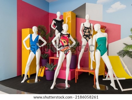 Mannequins in colorful swimsuits in clothes shop. Summer vacation. Fashion model. Colorful vacation concept Royalty-Free Stock Photo #2186058261