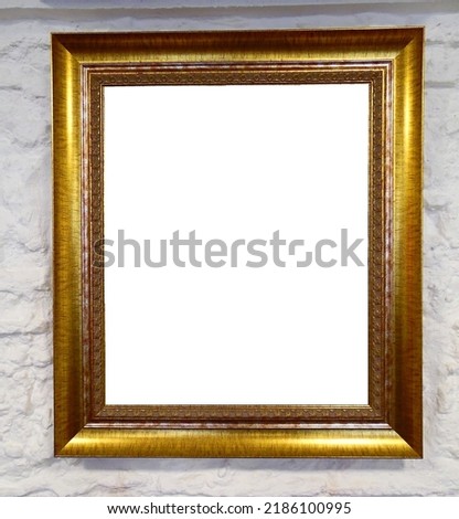golden frame for a picture on a light wall