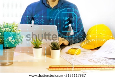 Engineers sit and work on building design and system work.,construction work safety,construction business and real estate Royalty-Free Stock Photo #2186117987