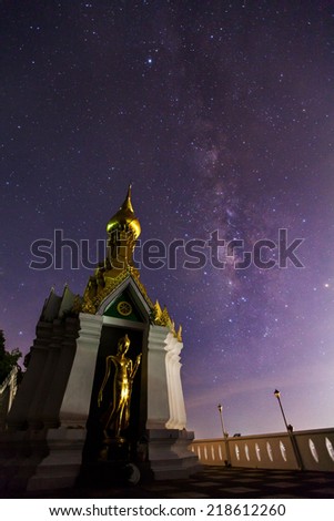 Milky Way at Standing gold Buddha image name is Wat Sra Song Pee Nong in Phitsanulok, Thailand 