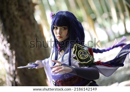 Portrait of a beautiful young woman game cosplay with samurai dress
