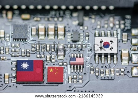 Flag of the Republic of China or Taiwan, China, Korea and USA on a processor, CPU or GPU microchip on a motherboard. Taiwan manufacturing chip industry emerges as battlefront in U.S. - China showdown. Royalty-Free Stock Photo #2186145939