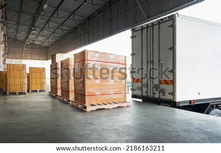 Packaging Boxes Wrapped Plastic Stacked on Pallets Loading into Cargo Container. Shipping Trucks. Delivery. Supply Chain Shipment. Distribution Supplies Warehouse. Freight Truck Transport  Logistics.	 Royalty-Free Stock Photo #2186163211