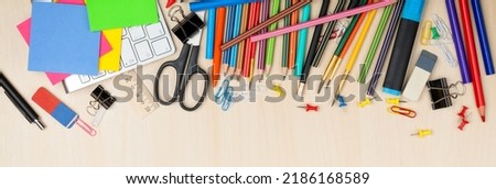 School and office supplies over office table. Flat lay with copy space Royalty-Free Stock Photo #2186168589