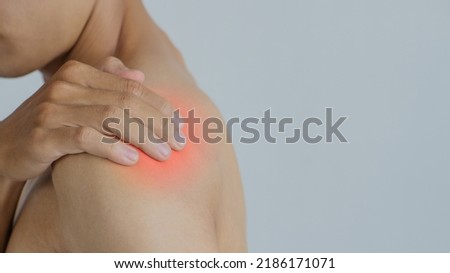 Young man suffering with shoulder pain.Office syndrome Concept.Health concept.copy space for text.
 Royalty-Free Stock Photo #2186171071