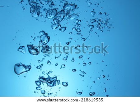 high resolution. bubbles in clean drinking water. beautiful blue background.