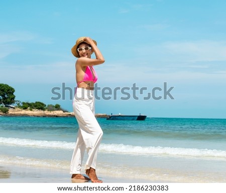 beach woman posing for a photo smiling happy