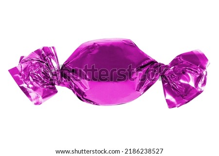 Candy in pink foil isolated. Candy wrapped in a label. Christmas