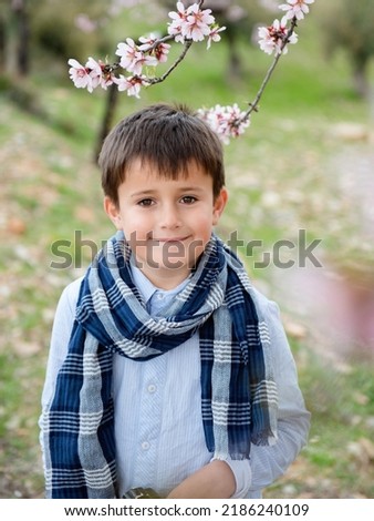 Portrait happy young boy looking at camera with smiling face