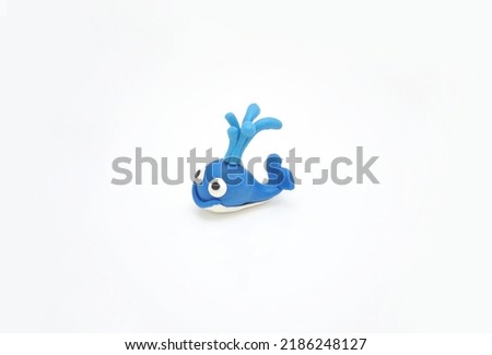 blue whale with a fountain made of plasticine