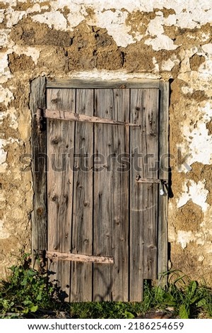 old wooden door in an old building locked. High quality photo