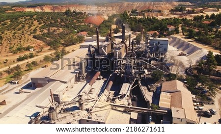 Drone aerial view of a factory in Greece. Impact on the environment concept. Air pollution. Water pollution. . High quality photo