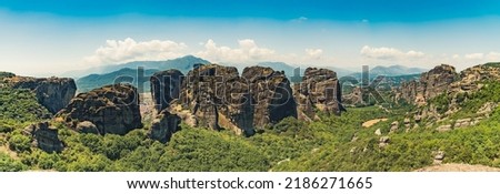 Aerial view, wide panoramic shot of known Greek rock formations and monasteries on the top. Meteora, Greece. Beautiful weather. High quality photo
