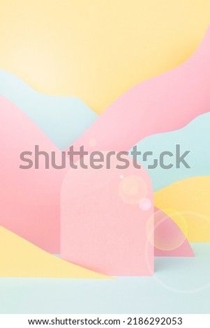 Abstract scene - pink arch podium, sunlight glow glare, mountain landscape -  pink, yellow, mint color in funny children style, vertical. Stage template for presentation cosmetic, goods, advertising.