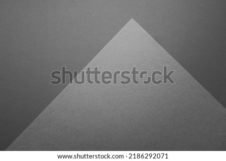 Carbon grey abstract geometric background with triangle surface with corner as monochrome stylish backdrop for text in elegant simple modern minimal style, top view, copy space.