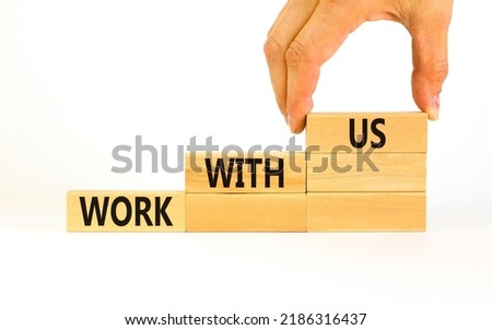 Work with us symbol. Concept words Work with us on wooden blocks on a beautiful white table white background. Businessman hand. Business, motivational and work with us concept. Copy space.