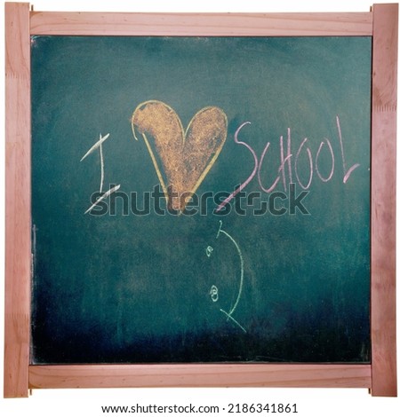 "I Love School" written on blackboard with colorful chalks.