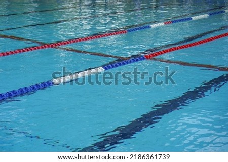 Lanes of a competition swimming pool. Empty swimming pool with lanes Royalty-Free Stock Photo #2186361739