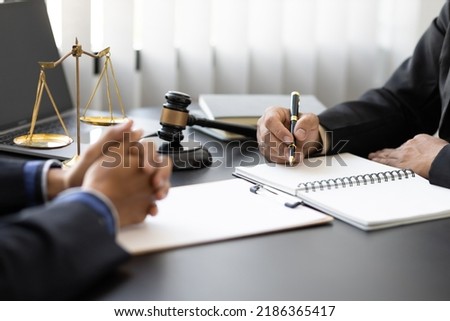 Attorneys in law firms listen to complaints, litigation and provide legal advice to clients. Royalty-Free Stock Photo #2186365417