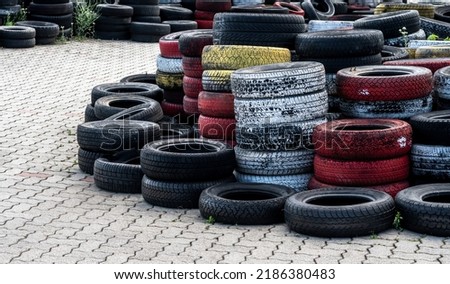Pile Of Old Used Car And Bike Tyres Representing Hazardous Waste And Material For Recycling Rubber  Royalty-Free Stock Photo #2186380483