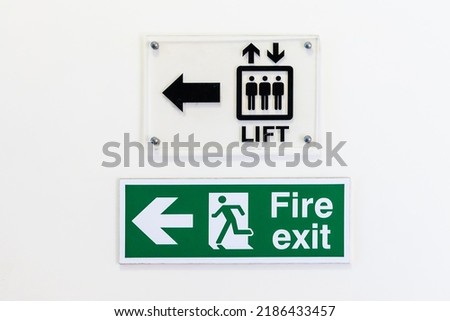 Fire exit sign and elevator sign - on white background.
