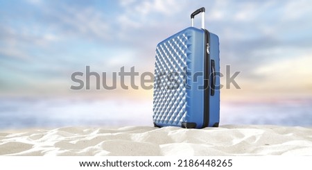 Blue suitcase on sand and summer landscape of sea 
