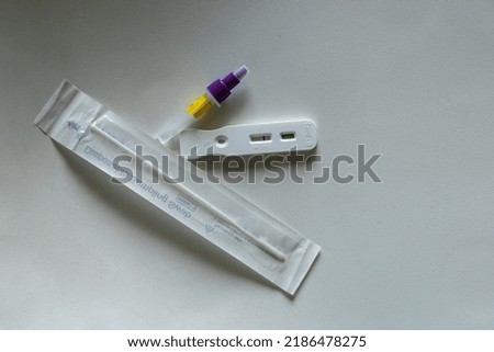 Coronavirus home testing kit against a white background with copy space. Covid-19 negative test result with SARS CoV-2 Rapid antigen test kit.