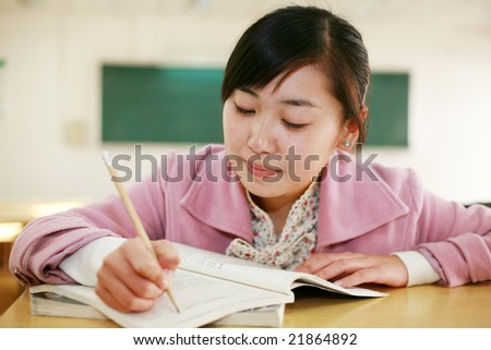 asian girl studying in a classroom