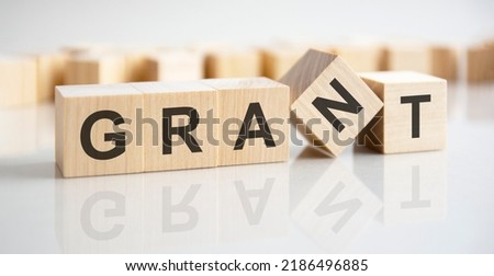 wooden blocks with the text: grant