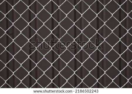 metal white mesh on a gray background,in the photo a mesh on a gray background.