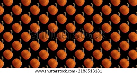Print orange pumpkins on a black background