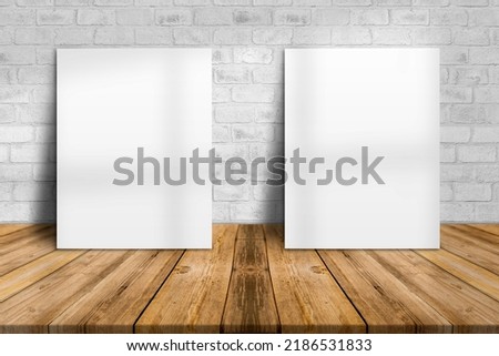 Blank white two paper poster on plank wooden floor and concrete wall, Template mock up for adding your content, leave side space for display of product.