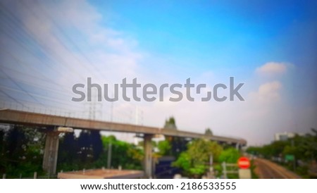 Defocused abstract background of LRt traffic rail, with beautiful blue sky panorama background