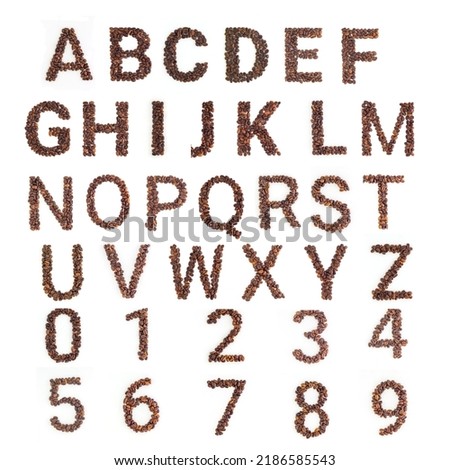 Coffee font. Alphabet made from coffee beans. White background. Roasted coffee beans.