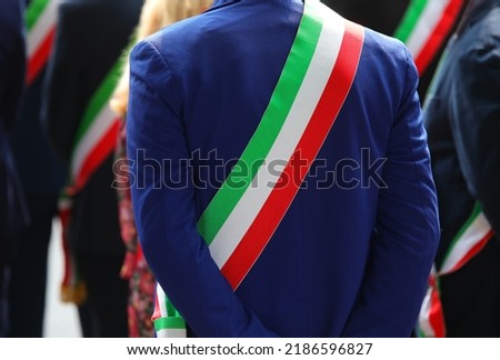 tricolor sash of the mayor dressed elegantly during a demonstration with many mayors in Italy Royalty-Free Stock Photo #2186596827