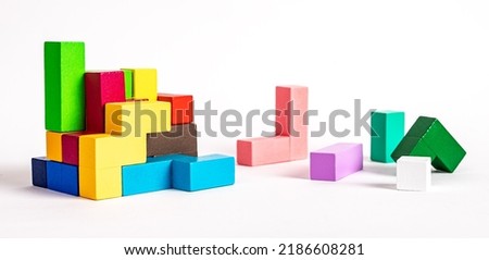 Colorful wooden elements of puzzle. Construction, formation concept. Kids logical game for problem solving skills development. High quality photo Royalty-Free Stock Photo #2186608281