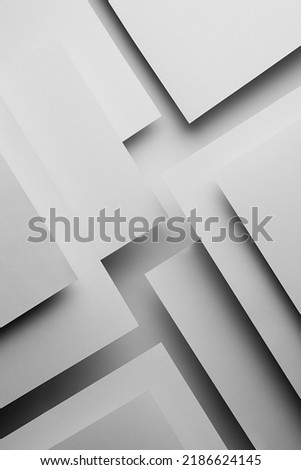White abstract geometric background in simple minimalist style with flying white surfaces as relievo pattern with parallel triangles, stripes, perspective, corners with glow and shadows, vertical.