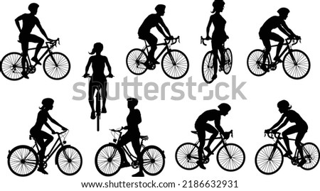A set of bicyclists riding bikes and wearing a safety helmet in silhouette Royalty-Free Stock Photo #2186632931