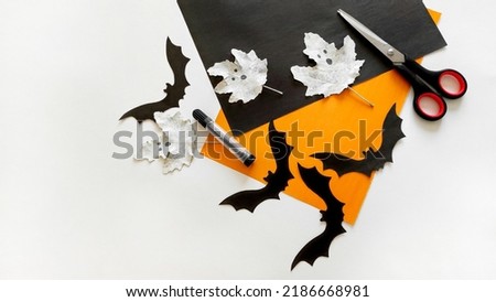 black paper bats, Halloween preparation process, Halloween craft scissor cutting, black paper bats, DIY funny ghosts, copy space