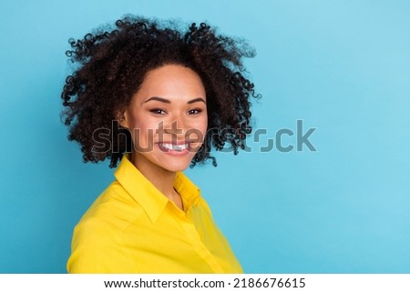 Profile photo of sweet curly hairdo young lady wear yellow blouse isolated on blue color background