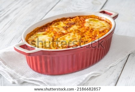 Tomato risotto with mozzarella in baking dish