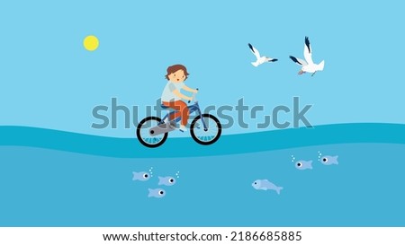 A boy rides a bicycle on the sea