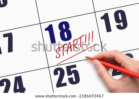 18th day of the month.  Hand writing text START and drawing a line on calendar date. Start Concept. The beginning of a new job. Business Challenge or do something New. Royalty-Free Stock Photo #2186693467