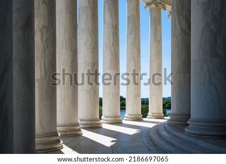 Architectural Columns with Sunlight Shining Through them Royalty-Free Stock Photo #2186697065