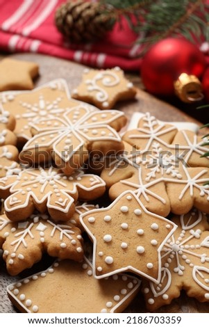 Tasty Christmas cookies on wooden table, closeup
