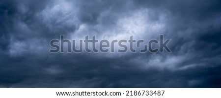 Storm clouds with the rain, nature Background.Beautiful storm sky with clouds and field, apocalypse, thunder, tornado, Depression, Typhoon.