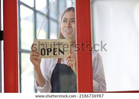 Portrait of a small entrepreneur woman standing and looking at the camera. Startup Small Business Concept